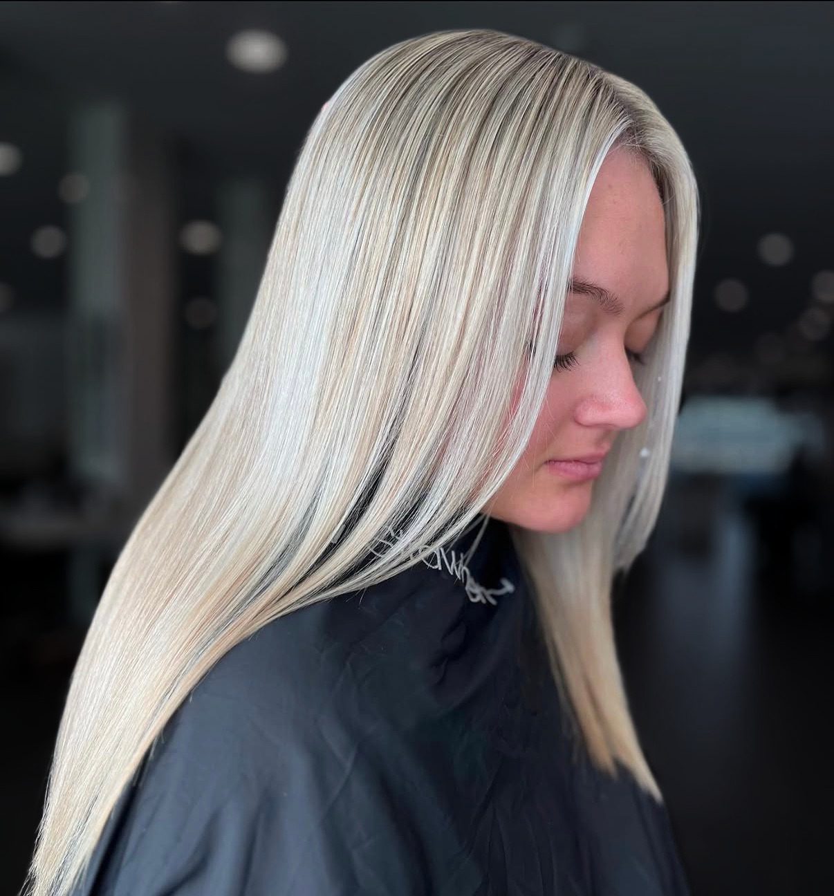Sleek straight platinum blonde, healthy and glossy