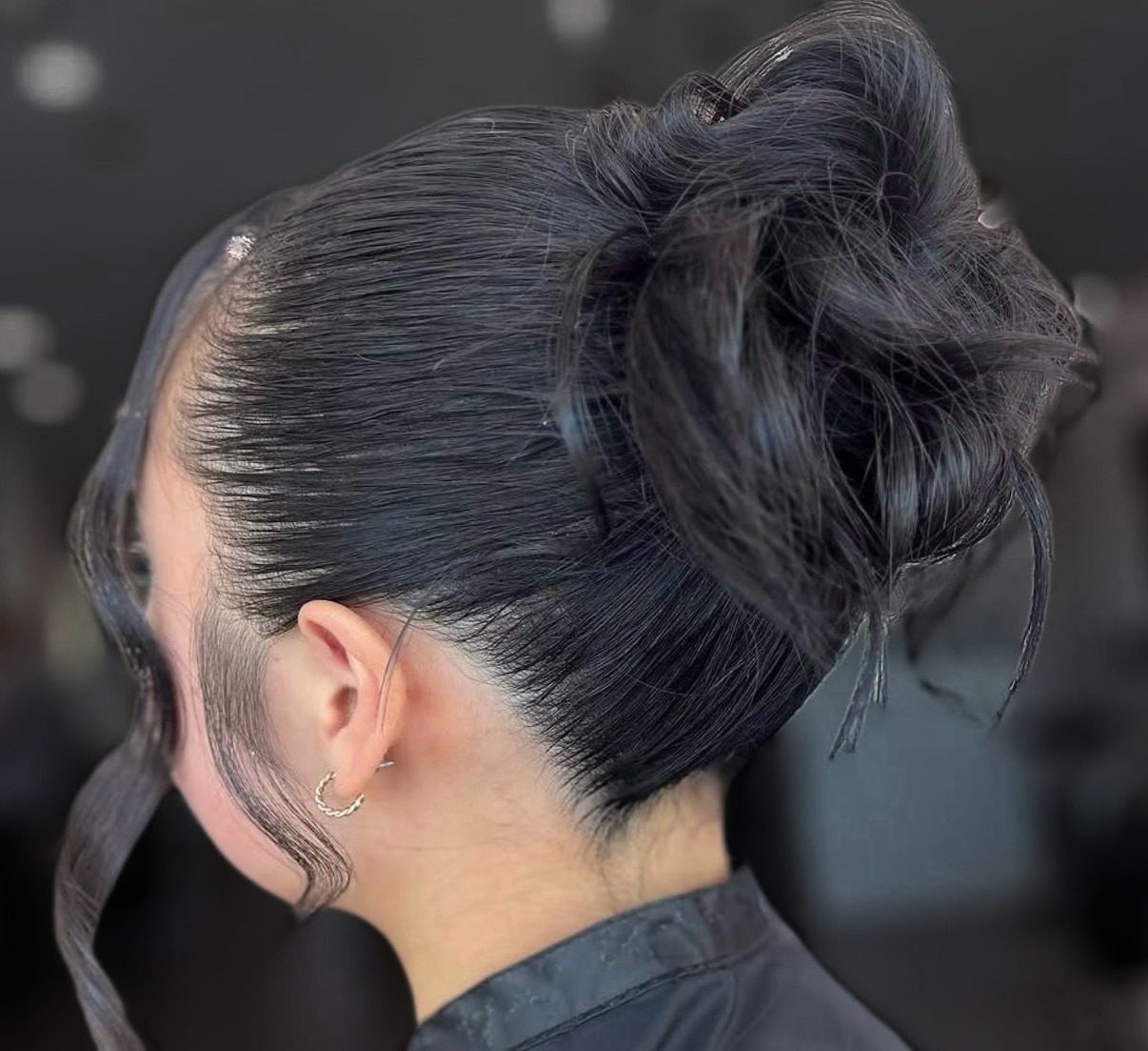 Textured event updo with soft, lived-in volume